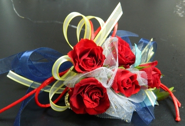 Red Sweetheart Roses with blue, yellow and white accents from local Myrtle Beach florist, Bright & Beautiful Flowers